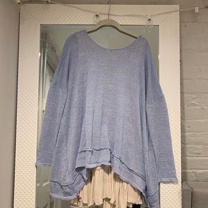 Hope’s blue sweater with ruffle layering tank